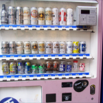 How to Start a Vending Machine Business: A Practical Guide for Beginners Owner restocking a vending machine as part of a small vending machine business