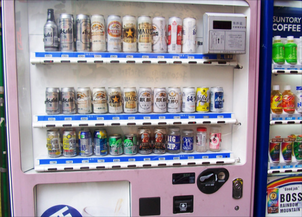 How to Start a Vending Machine Business: A Practical Guide for Beginners Owner restocking a vending machine as part of a small vending machine business