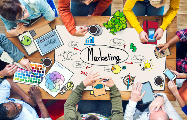 Marketing Tips for Small Business Owners Who Don’t Have a Marketing Team Small business owner reviewing marketing advice for small business growth