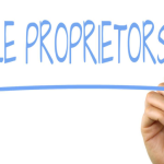 How to Start a Sole Proprietorship Without Losing Your Mind Freelancer managing sole proprietorship paperwork at home